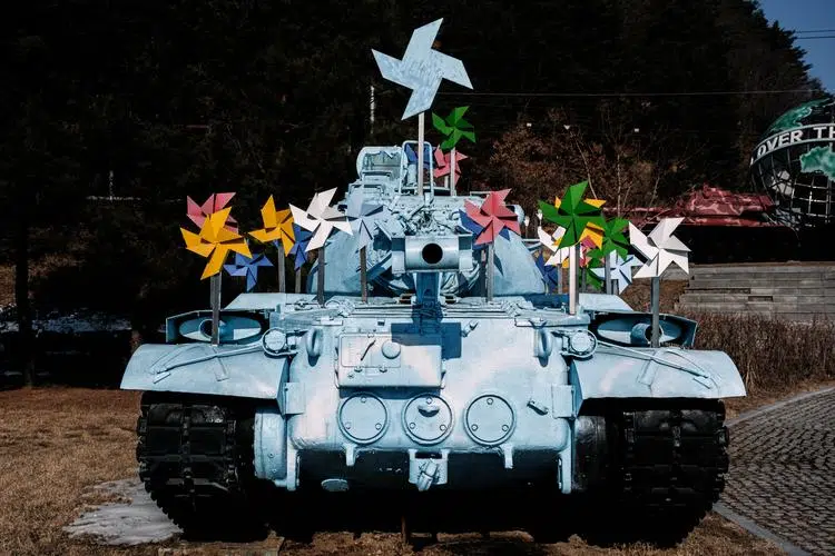 An old tank transformed into a work of art at Hwacheon Peace Park.