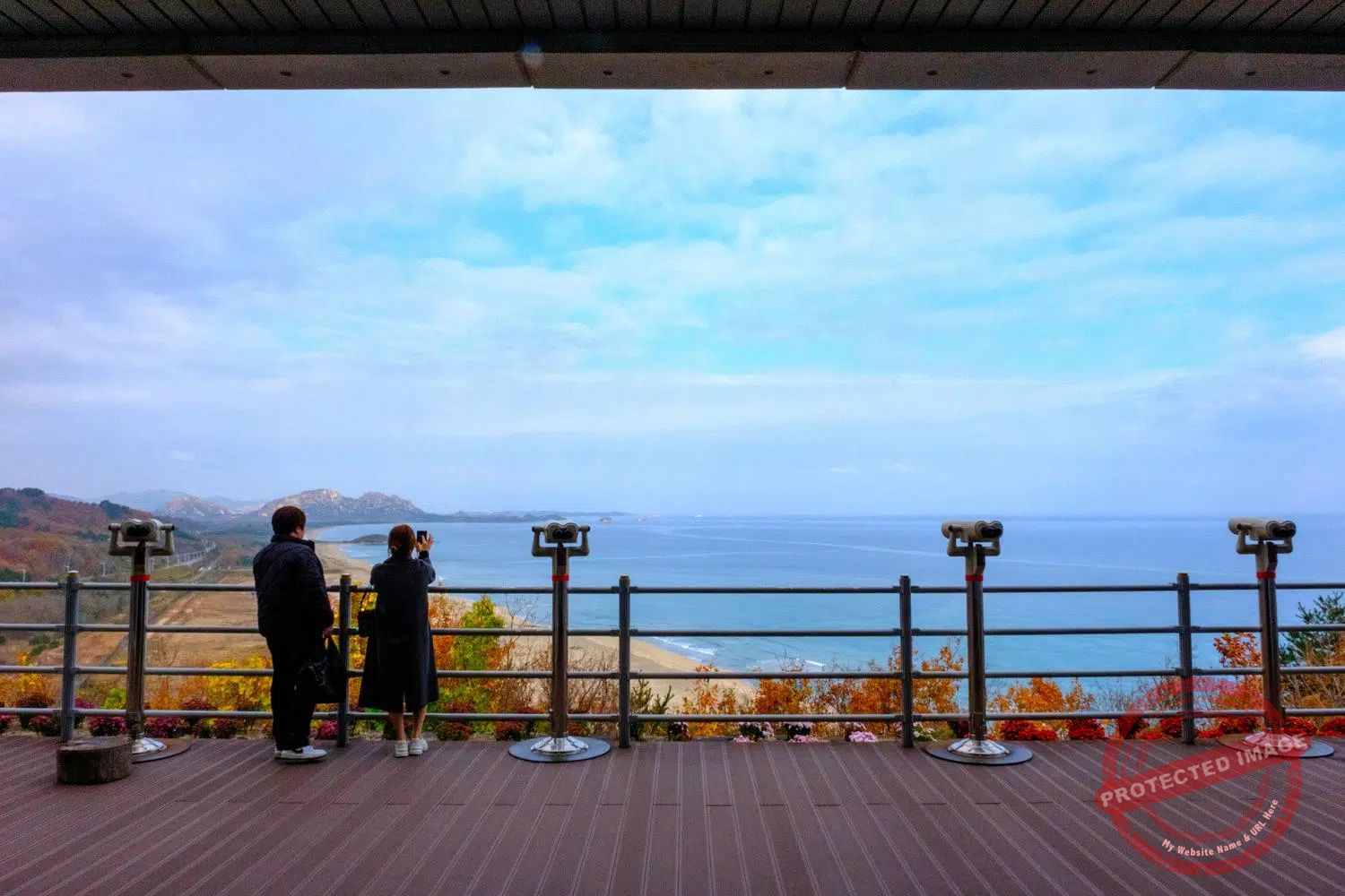 A couple watches the Sea of Japan and the coast of North Korea from the Goseong Observatory (November 2025).