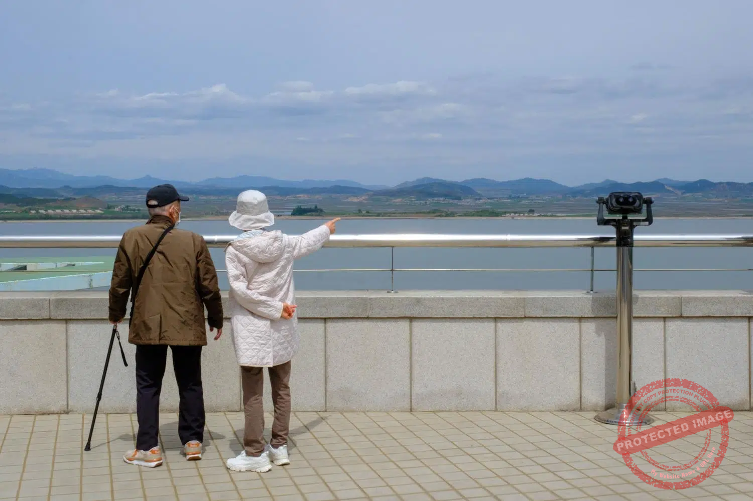 ganghwa-observatory-couple A couple observes North Korea from the Ganghwa Observatory (May 2025).