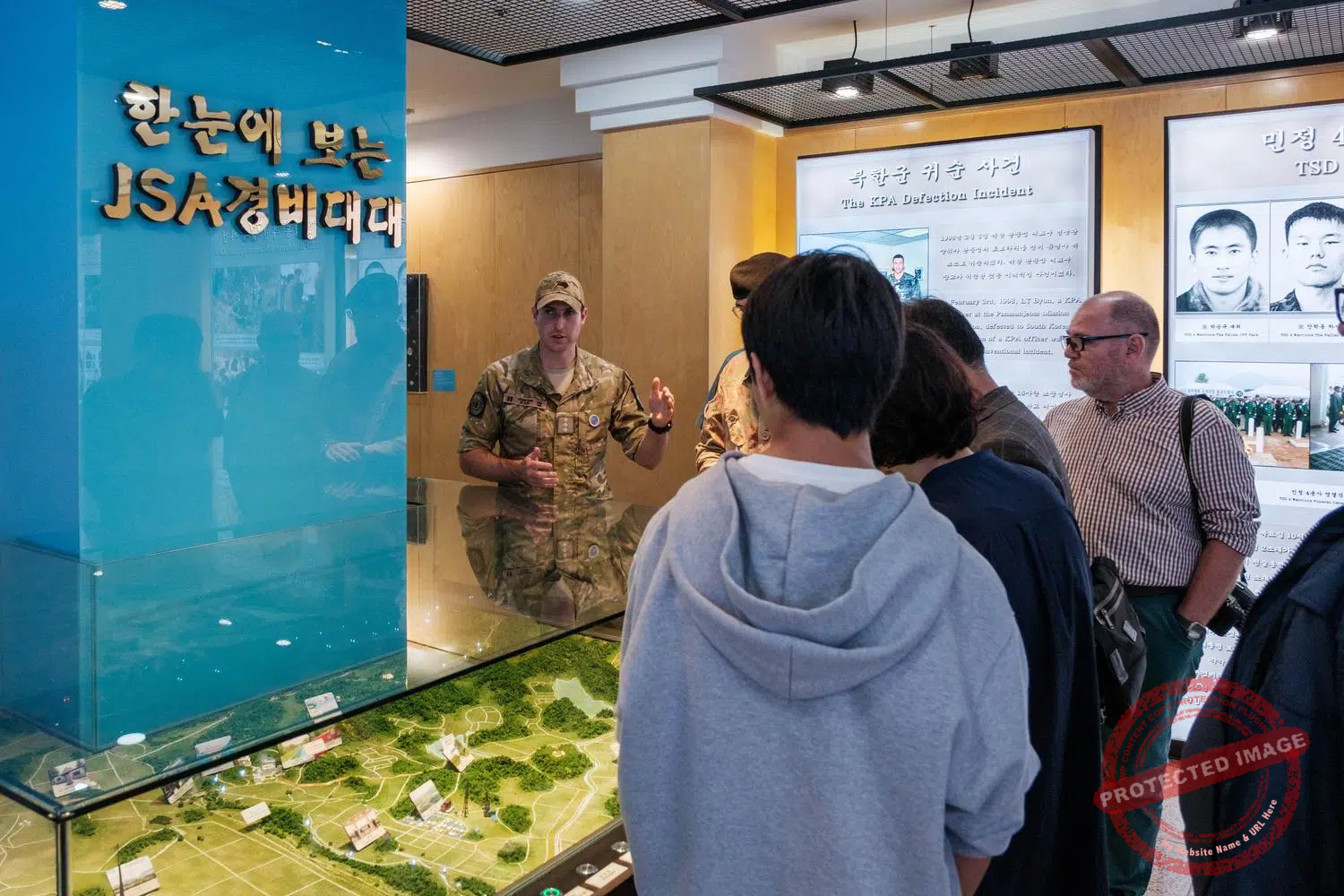 jsa-camp-bonifas-exhibition A New Zealand officer briefs a group of tourists at the JSA Visitor Center in Camp Bonifas, a United Nations Command (UNC) military base at the edge of the DMZ (October 2024).