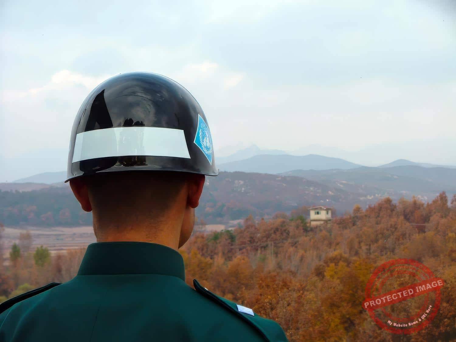 jsa-joint-security-area-200511-01 A South Korean soldier watches a North Korean Guard Post across the Military Demarcation Line in the DMZ (November 2005).
