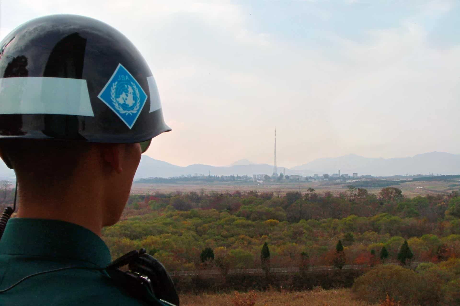 A South Korean Soldier from the United Nations Command Security Battalion observes the North Korean landscape from the Joint Security Area (November 2005).