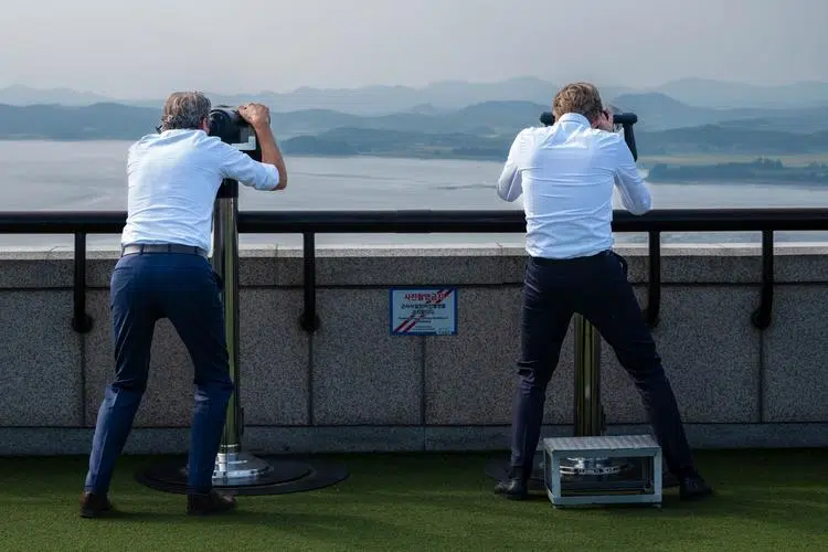 Visitors watch North Korea from the Odusan Unification Observatory in Paju.