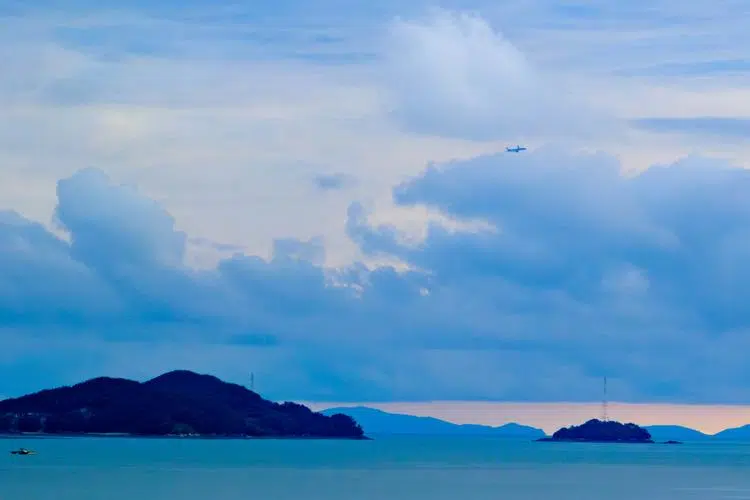 A plane turns left in the sky after taking off from Incheon Airport.
