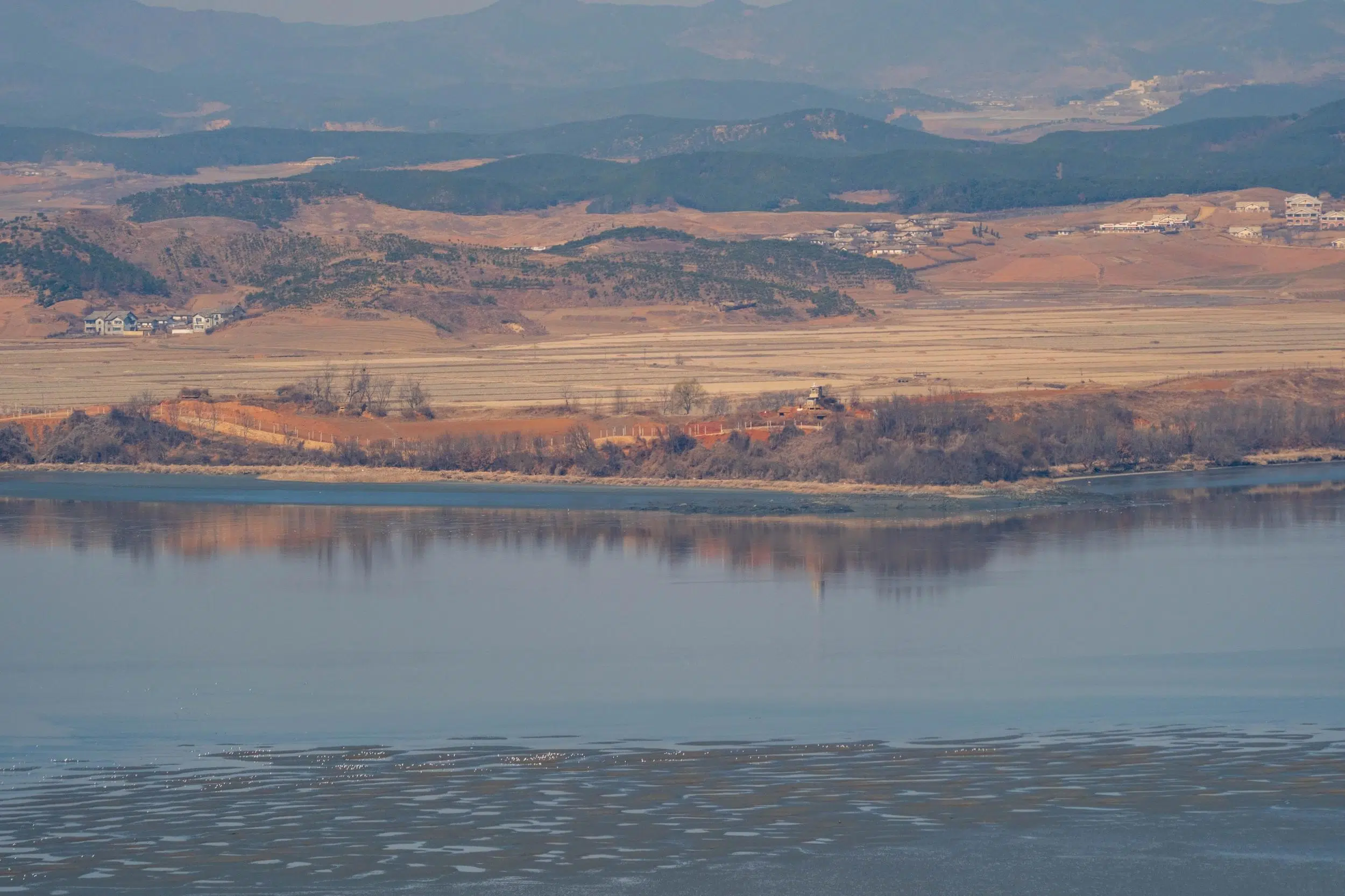odusan-maegon-north-korea-bank-february-2025 The North Korean bank of the Han River, as seen from the Odusan Observatory (February 2025).
