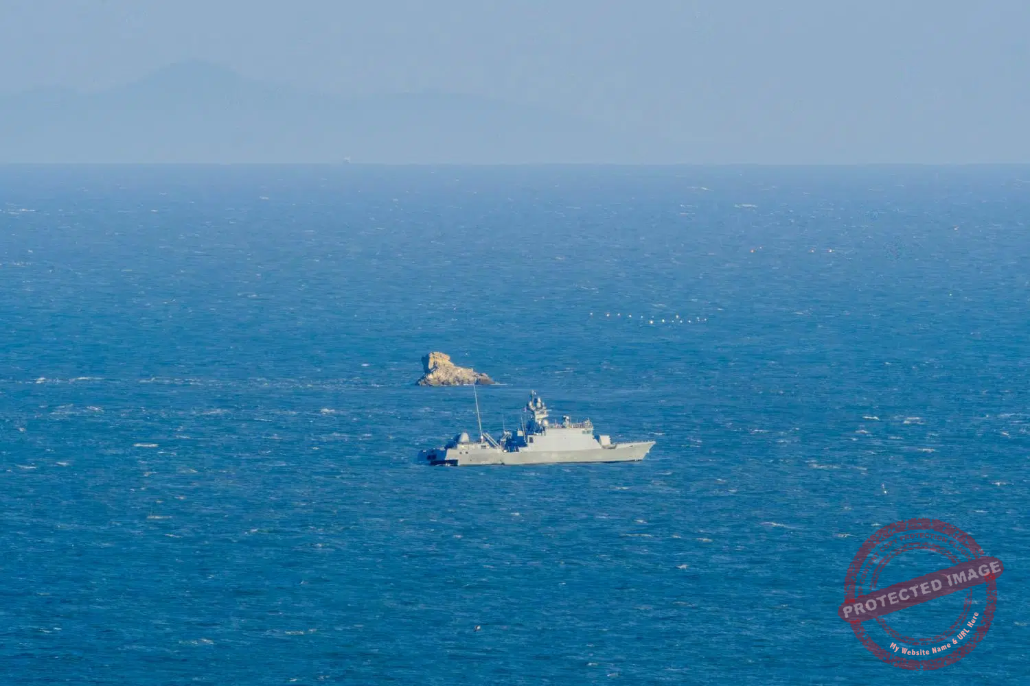 The ROKS Han Sang Guk, a PKG (Patrol Killer Guided) missile patrol vessel, sails near the coast of Yeonpyeong in May 2025. Its primary role is fast interception, coastal defense and engagement of small hostile naval units such as North Korean patrol boats. The ship is named in honor of one of the South Korean sailors killed during the Second Battle of Yeonpyeong in 2002.