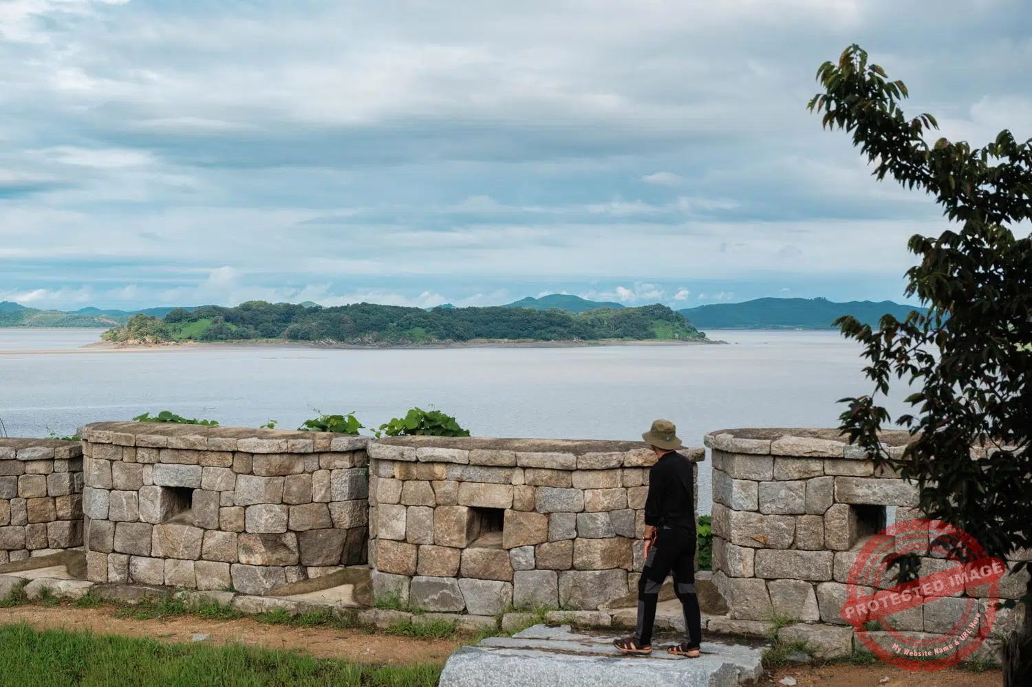 yu-do-island-ganghwa Yu-do (or Yu Island) in the middle of the Han River Estuary, between North Korea and South Korea, seen from the top of the wall of Yeonmijeong Pavilion in the northeast of Ganghwa Island (September 2025).